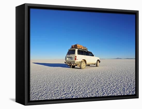 Bolivia, Potosi Department, Daniel Campos Province, White Toyota Landcruiser on the Salar de Uyuni,-Karol Kozlowski-Framed Stretched Canvas