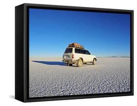 Bolivia, Potosi Department, Daniel Campos Province, White Toyota Landcruiser on the Salar de Uyuni,-Karol Kozlowski-Framed Stretched Canvas