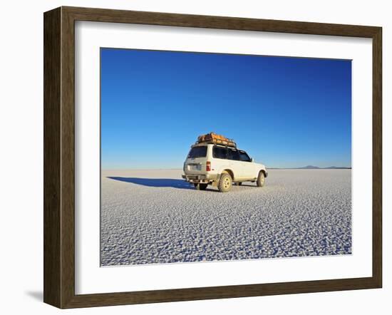 Bolivia, Potosi Department, Daniel Campos Province, White Toyota Landcruiser on the Salar de Uyuni,-Karol Kozlowski-Framed Photographic Print