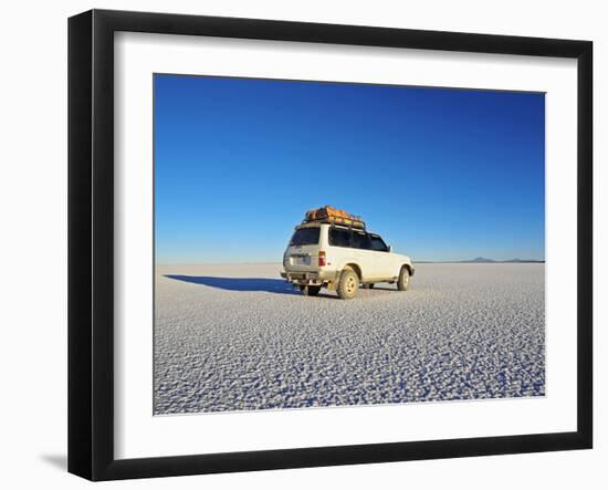 Bolivia, Potosi Department, Daniel Campos Province, White Toyota Landcruiser on the Salar de Uyuni,-Karol Kozlowski-Framed Photographic Print