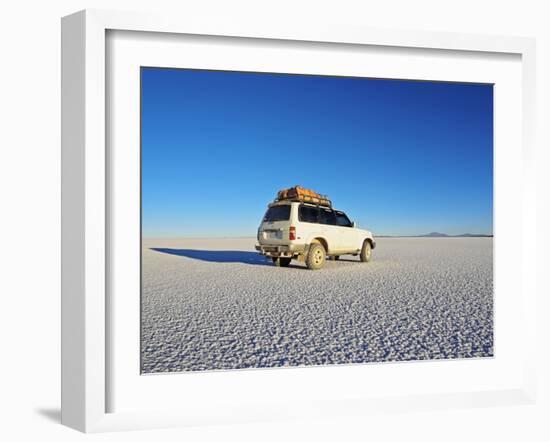 Bolivia, Potosi Department, Daniel Campos Province, White Toyota Landcruiser on the Salar de Uyuni,-Karol Kozlowski-Framed Photographic Print