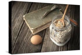 Book of Recipes and Ingredients for Cookies on a Wooden Table Horizontal-Denis Karpenkov-Stretched Canvas