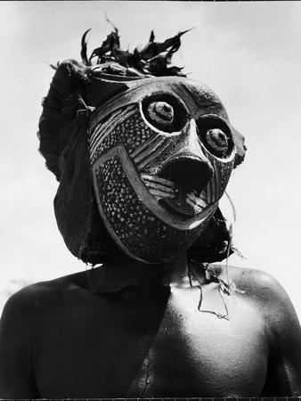 https://imgc.allpostersimages.com/img/posters/bopende-tribesman-of-western-congo-wearing-mask-during-initiation-of-boys-into-tribal-society_u-L-Q1HSV3K0.jpg?artPerspective=n
