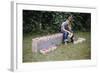 Bored Child Sitting with Raspberry Cartons-William P. Gottlieb-Framed Photographic Print