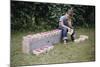 Bored Child Sitting with Raspberry Cartons-William P. Gottlieb-Mounted Photographic Print