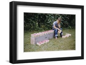 Bored Child Sitting with Raspberry Cartons-William P. Gottlieb-Framed Photographic Print