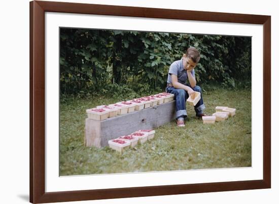 Bored Child Sitting with Raspberry Cartons-William P. Gottlieb-Framed Photographic Print