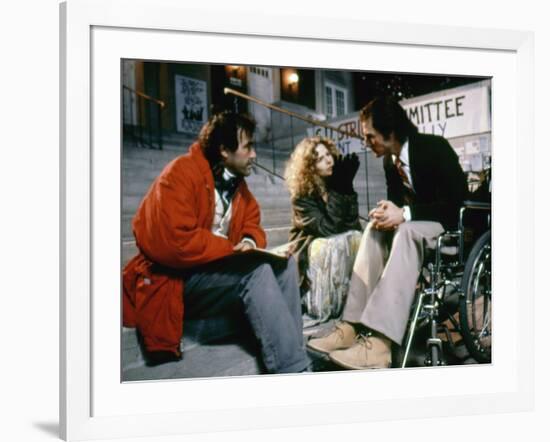 BORN ON THE FOURTH OF JULY, 1989 directed by OLIVER STONE On the set, Oliver Stone directs Kira Sed-null-Framed Photo