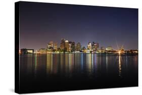 Boston Downtown with Urban City Skyline at Night with Skyscrapers Illuminated over Sea.-Songquan Deng-Stretched Canvas