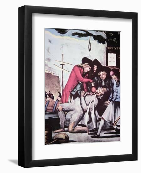 Boston Patriots Forcing British Tea into a Tax Collector, Who Has Been Tarred and Feathered, 1773-null-Framed Giclee Print