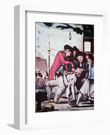 Boston Patriots Forcing British Tea into a Tax Collector, Who Has Been Tarred and Feathered, 1773-null-Framed Giclee Print