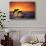 Bottlenosed Dolphins Leaping at Sunset-DLILLC-Stretched Canvas displayed on a wall