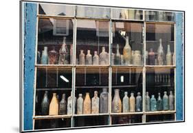 Bottles In New Orleans Louisiana Storefront-null-Mounted Poster