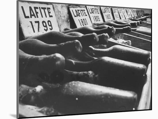 Bottles of Lafite Wines, Now Museum Pieces in French Wine Cellar-Carlo Bavagnoli-Mounted Photographic Print