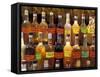 Bottles of Local Rum Drinks at Le Diamant Village, Martinique, West Indies, Caribbean-Guy Thouvenin-Framed Stretched Canvas