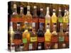 Bottles of Local Rum Drinks at Le Diamant Village, Martinique, West Indies, Caribbean-Guy Thouvenin-Stretched Canvas