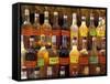 Bottles of Local Rum Drinks at Le Diamant Village, Martinique, West Indies, Caribbean-Guy Thouvenin-Framed Stretched Canvas