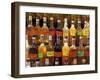 Bottles of Local Rum Drinks at Le Diamant Village, Martinique, West Indies, Caribbean-Guy Thouvenin-Framed Photographic Print