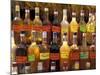 Bottles of Local Rum Drinks at Le Diamant Village, Martinique, West Indies, Caribbean-Guy Thouvenin-Mounted Photographic Print