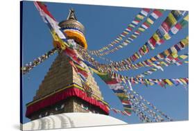 Bouddha (Boudhanath) (Bodnath) in Kathmandu is covered in colourful prayer flags, Kathmandu, Nepal-Alex Treadway-Stretched Canvas