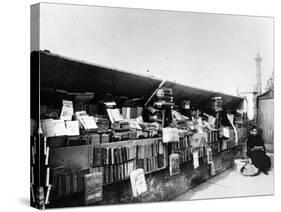 Bouquiniste Beside the River Seine in Paris, C.1900 (B/W Photo)-French Photographer-Stretched Canvas