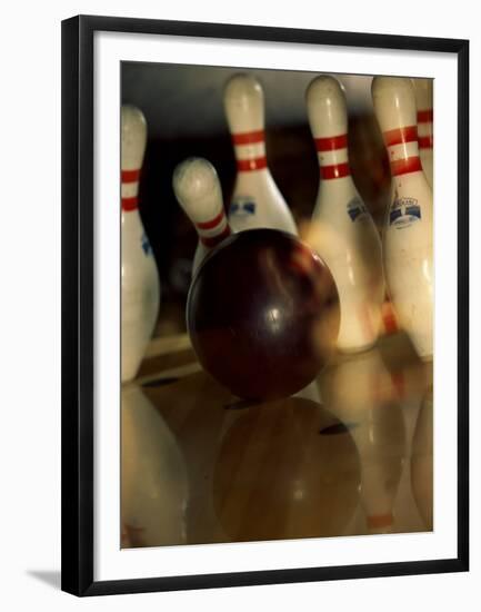 Bowling Ball Striking Pins-null-Framed Premium Photographic Print