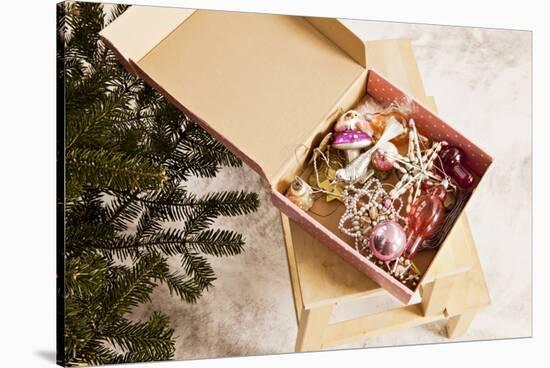 Box with Chistmas Ornaments Next to Christmas Tree, Munich, Bavaria, Germany-Dario Secen-Stretched Canvas