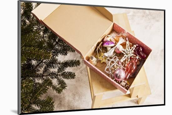 Box with Chistmas Ornaments Next to Christmas Tree, Munich, Bavaria, Germany-Dario Secen-Mounted Photographic Print