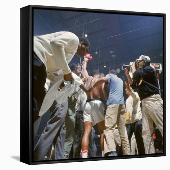 Boxer Cassius Clay, aka Muhammad Ali, Raising Fist in Triumph After Beating Sonny Liston-John Dominis-Framed Stretched Canvas