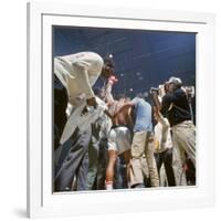 Boxer Cassius Clay, aka Muhammad Ali, Raising Fist in Triumph After Beating Sonny Liston-John Dominis-Framed Premium Photographic Print