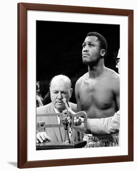 Boxer Joe Frazier at the Weigh in for His Fight Against Muhammad Ali-John Shearer-Framed Premium Photographic Print