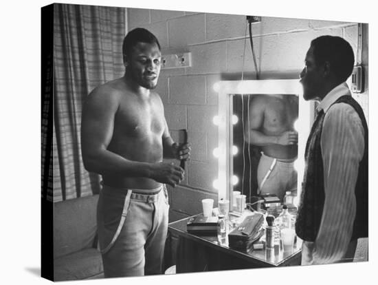 Boxer Joe Frazier Dressing During Training for a Fight Against Muhammad Ali-John Shearer-Stretched Canvas