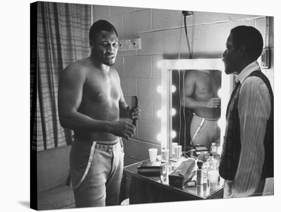 Boxer Joe Frazier Dressing During Training for a Fight Against Muhammad Ali-John Shearer-Stretched Canvas