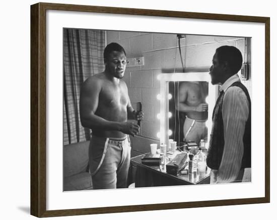 Boxer Joe Frazier Dressing During Training for a Fight Against Muhammad Ali-John Shearer-Framed Premium Photographic Print