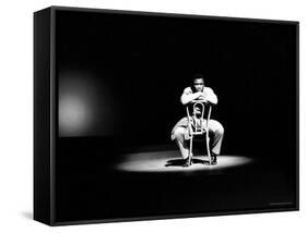 Boxer Joe Frazier Sitting on a Chair under a Spotlight-John Shearer-Framed Stretched Canvas