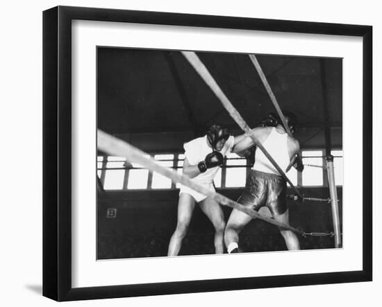 Boxer Joe Louis Fighting in Boxing Match-null-Framed Photographic Print