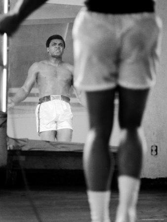https://imgc.allpostersimages.com/img/posters/boxer-muhammad-ali-jumping-rope-while-watching-himself-in-mirror-during-training-for-his-fight_u-L-P47T7F0.jpg?artPerspective=n