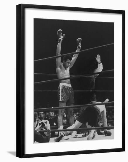 Boxer Muhammad Ali Raising His Gloves Victoriously After Knocking Out Oscar Bonavena-Bill Ray-Framed Premium Photographic Print