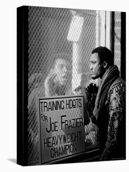 Boxer Muhammad Ali Taunting Rival Joe Frazier at Frazier's Training Headquarters-John Shearer-Stretched Canvas