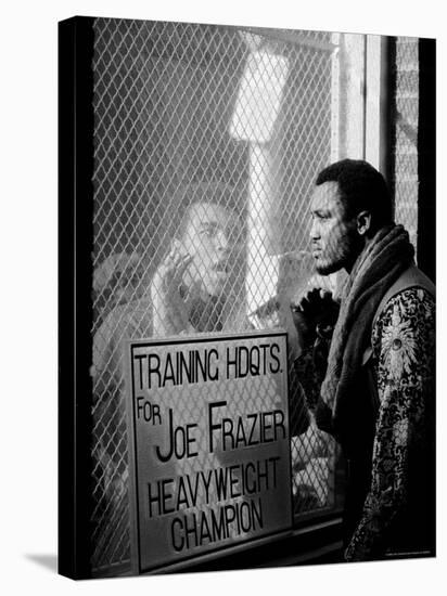 Boxer Muhammad Ali Taunting Rival Joe Frazier at Frazier's Training Headquarters-John Shearer-Stretched Canvas