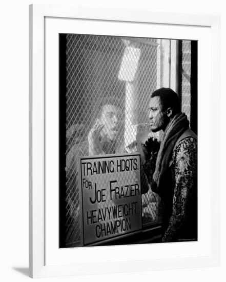 Boxer Muhammad Ali Taunting Rival Joe Frazier at Frazier's Training Headquarters-John Shearer-Framed Premium Photographic Print