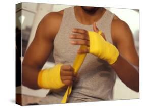 Boxer Wrapping His Hands-Chris Trotman-Stretched Canvas