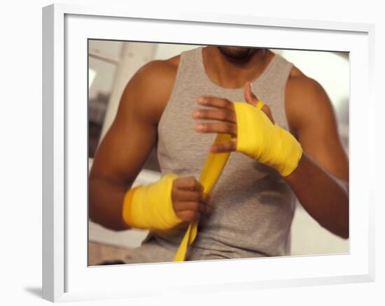 Boxer Wrapping His Hands-Chris Trotman-Framed Photographic Print