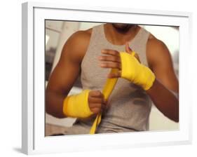 Boxer Wrapping His Hands-Chris Trotman-Framed Photographic Print