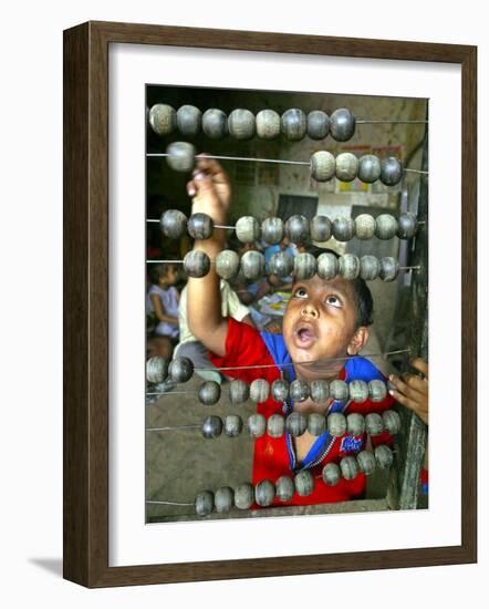 Boy, 3, Counts on an Abacus at a School in Allahabad-null-Framed Photographic Print