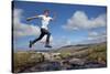 Boy (Aged 17) Jumping across Upland Stream-Mark Hamblin-Stretched Canvas