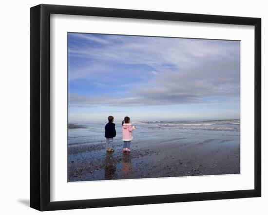 Boy Aged Four and Girl Aged Three on a Black Volcanic Sand Beach in Manawatu, New Zealand-Don Smith-Framed Photographic Print