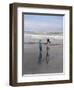 Boy and Girl on at Edge of Ocean Running and Holding Hands.-Nora Hernandez-Framed Giclee Print