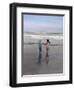 Boy and Girl on at Edge of Ocean Running and Holding Hands.-Nora Hernandez-Framed Giclee Print