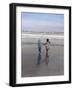 Boy and Girl on at Edge of Ocean Running and Holding Hands.-Nora Hernandez-Framed Giclee Print